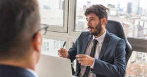 man in suit in a meeting