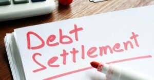 Debt settlement written in red