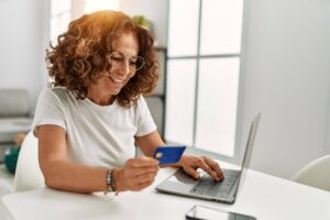 woman entering credit card information online