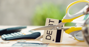 (scissors cutting a credit card in half)