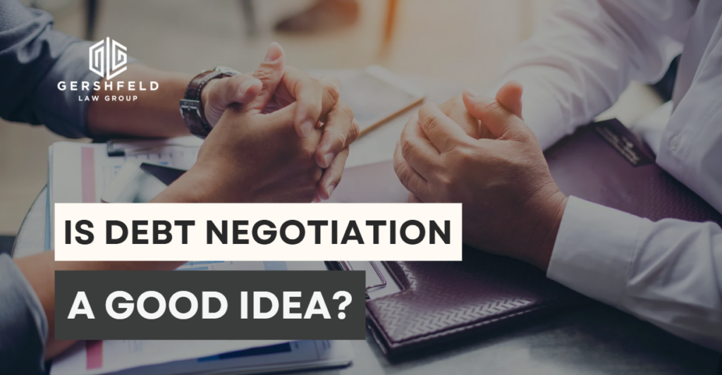 Two individuals sit across a desk discussing financial documents, with the text "Is Debt Negotiation a Good Idea?" overlaid—representing legal or financial consultation with Gershfeld Law Group.