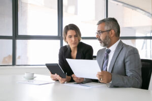 Person reviewing financial documents during the debt mediation process.