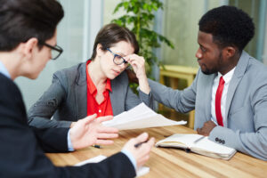 Client discussing debt mediation and credit impact with a legal professional.