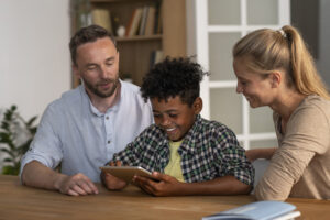 Parents reviewing documents with their children