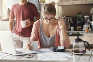 Couple reviewing bills and household finances at home